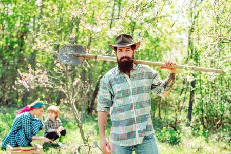 Fathers day. Man farmer. Family crop planting at fields. Family planting.の写真素材