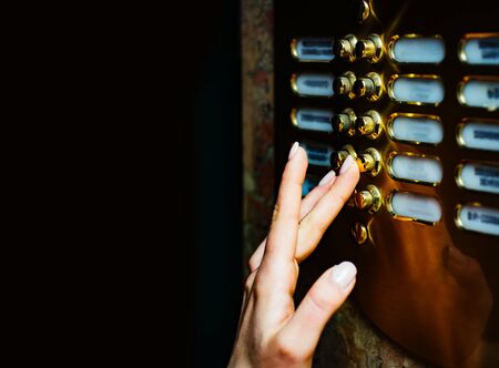 Female hands close up. Clicking the button. Fashion and beauty. Beautiful hands.