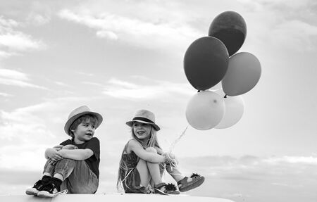Happy brother and sister. Emotional kids walks outdoors and enjoy walking. Happy kids smiling and having fun. Children outdoors in nature.の写真素材