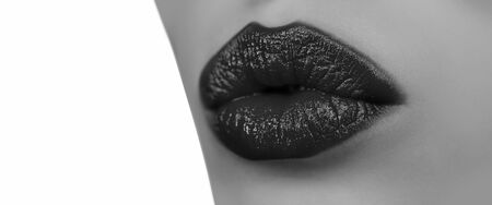 Young woman with perfect skin. Red lipstick. Isolated on white. Sensual model girl with smooth skin and makeup. Kiss. Valentines day.の写真素材