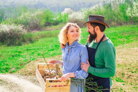 Become organic farmer. Worker family agriculture. Gardening in spring - happy couple harvesting and having lots of fun. I love our moments in the countryside.の写真素材