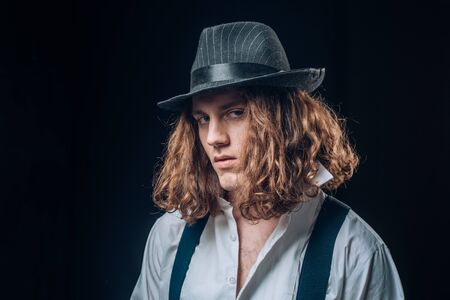 Portrait muscular man in hat. Handsome strong sporty perfect seductive confident man. Man portrait....