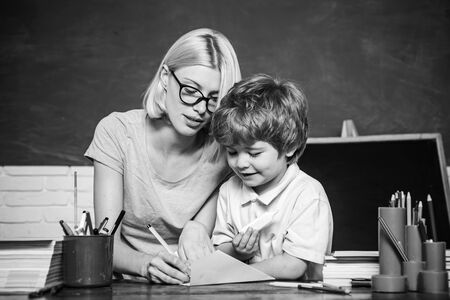Elementary school - education and learning child concept. Boy and girl from elementary school at the school yard. Ready for school. Education.の写真素材