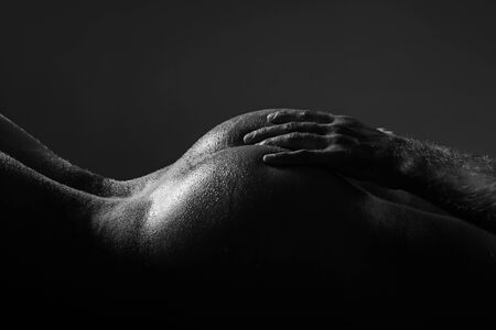 Masturbation and orgasm. Contraception. Womans secrets and sensual temptation. Female orgasm and masturbation concept. Ass with men love hands.の写真素材