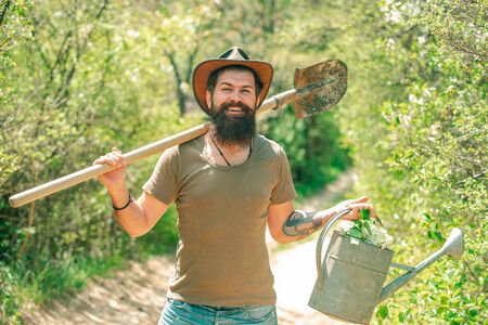 Funny Farmer with Shovel and watering can.の写真素材