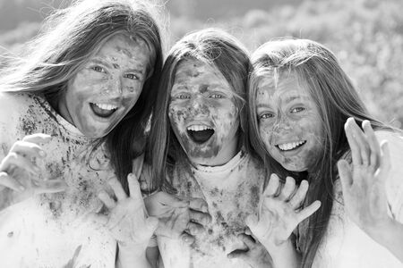 Emotional girls with happy mood with colorful dry colors. children with creative body art. Crazy...