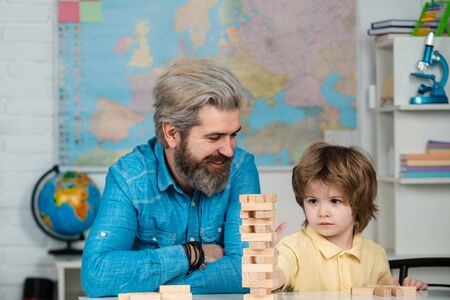 Teacher and pupil. Elementary school tutorship. School community partnership models. Happy father...