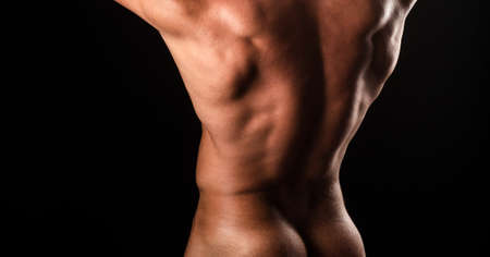 Gorgeous stylish man. Male hunk with athletic body. Male buttocks. Naked bodybuilder back.の写真素材