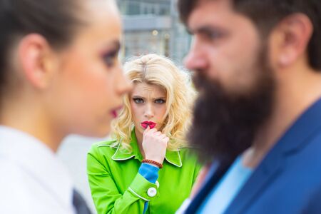 Obsessed ex girlfriend spying to a couple dating. She is obviously jealous. Bearded man cheating his...