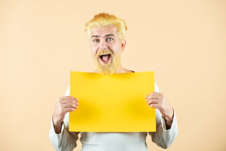 Funny Business man showing thumb up holds sign board. Businessman holding a blank banner and looking down to copy space. Season sales.の写真素材