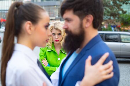 Jealous woman look at couple in love on street. Really jealous of him. Romantic couple of man and...