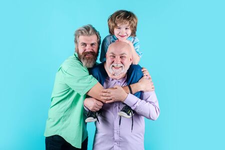Happy man family concept laugh and have fun together. Three generations ages: grandfather father and...