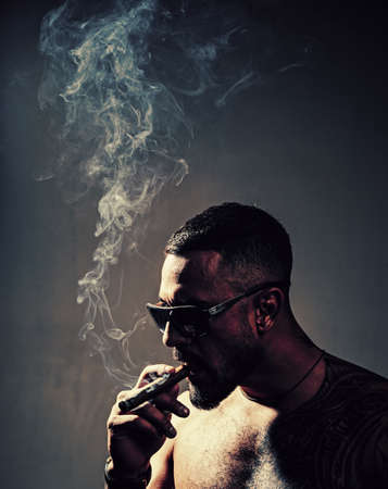 Cigar store. Men with cigars. Cigar cuban. Smoking gangster. Cigar products.の写真素材