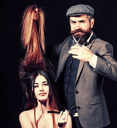 Long hair. Fashion haircut. Hairdresser, beauty salon. Master hairdresser does hairstyle and style. Hairdresser makes hairstyle. Barbershop.の写真素材