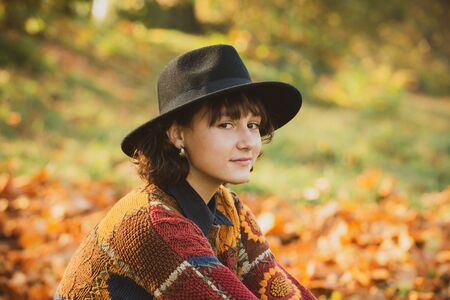 Autumn day. Autumn outdoor portrait of beautiful girl walking in park or forest. Outdoor.