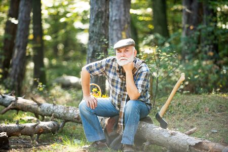 Old bearded man in forest. Fashion portrait man. Aged funny forester. Woodman in forest. Old bearded...