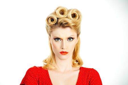 Serious young woman. Crazy furious young pin up woman standing over white background. Pin up woman...
