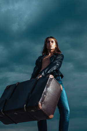 Sexy woman with luggage, attractive woman. Passionate sexy woman. Seductive and beautiful young woman.の写真素材