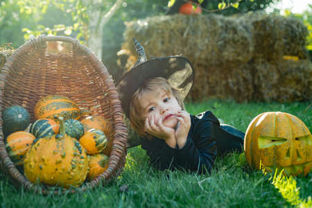 Boy cute playful cheerful child funny grimace face. Happy little boy. Halloween Kids Costume Party.の写真素材
