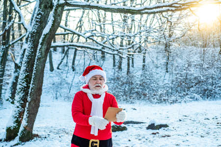 Merry Christmas and Happy New Year concept. Merry Christmas and Happy new year. Santa Claus with a huge bag. Santa Claus with big bag.の写真素材