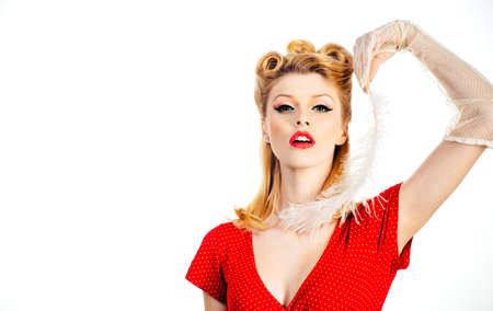 Pin up woman portrait. Beautiful retro female with red lips and old fashion hairstyle.