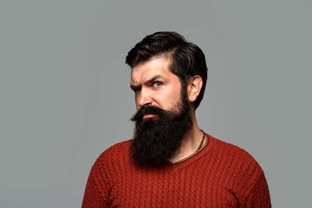 Businessman thinking with expression looking. Handsome bearded man, closeup face.