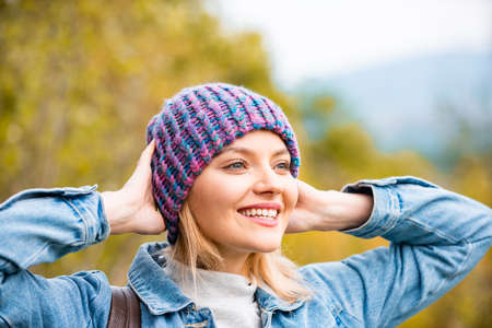 Close up portrait of beautiful blond girl on autumn background.の写真素材