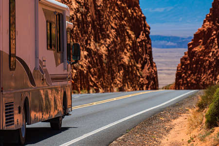 American road trip. Natural american landscape with asphalt road to horizon.