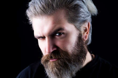 Close up portrait of attractive man with long beard.の写真素材