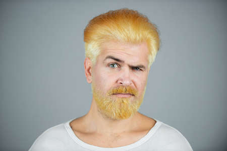 Blonde man with long beard and moustache.