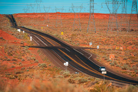Natural american landscape with asphalt road to horizon. Countryside landscape in USA.