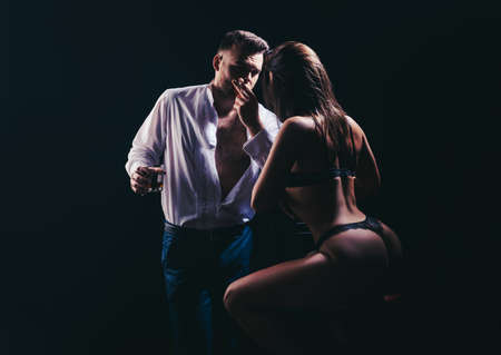 Sexy couple in love. Sensual lovers undressed. Girlfriend and boyfriend sensual hugging. Boy girl...