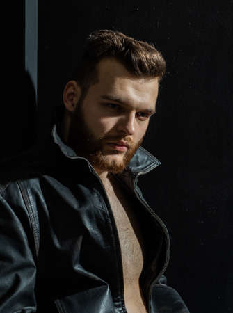 Fashionable handsome guy in look at camera, Fashion man. Sexy male model dressed elegant, mans vogue.の写真素材