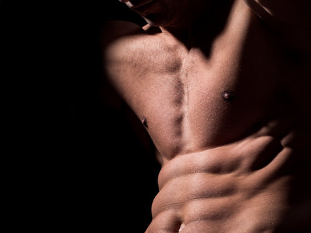 man with muscular body and bare torso.の写真素材