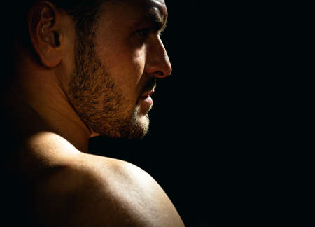 Portrait of stylish handsome young man on black. Fashion guy.の写真素材