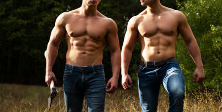Eotic man. Strong men showing his perfect naked body. Bare torso. Nature outside, outdoor.の写真素材