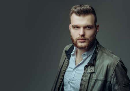 Sexy man isolated on grey background isolated. Fashion male model.の写真素材