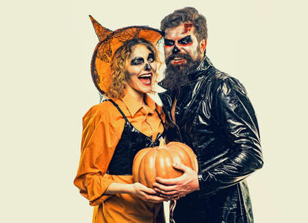 Cute man and woman wearing Halloween clothes. Best friends celebrated Halloween. Couple posing with Pumpkin.の写真素材