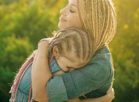 Lifestyle portrait mom and daughter in happy mood at the outside. People happiness and love.の写真素材