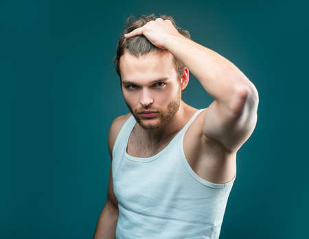Man hair style and trend. Male beauty concept. Stylish haircut, hairstyle. Handsome guy with...
