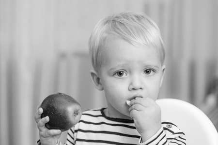 Baby nutrition. Eat healthy. Toddler having snack at home. Child eat porridge. Kid cute boy blue...