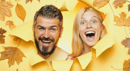 Autumn mood and weather are warm and sunny and rain is possible. Happy couple, bearded man and blond...