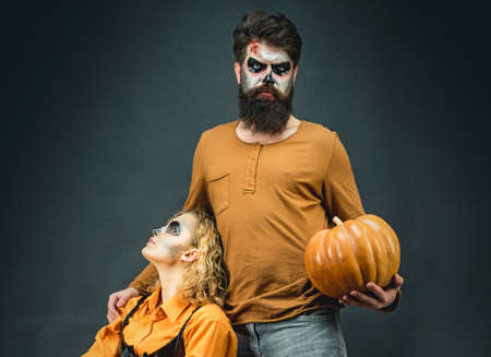 Couple man and woman wearing Halloween clothes. Halloween party and holiday concept. Trick or treat.