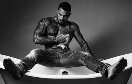 Male care. Sexy of handsome topless male model. Men bodycare. Men with well-groomed male body. Sexy mele on bathroom. Body care.の写真素材