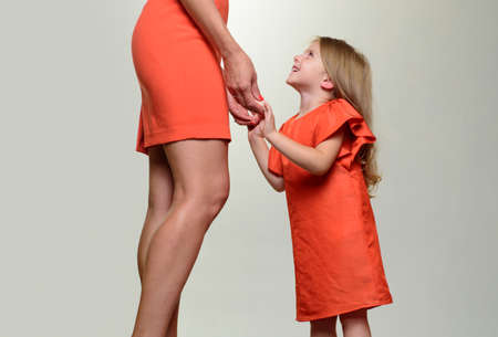 Little girl grow up. Daughter and mothers in love. Learning to be a woman. Mothers day.の写真素材