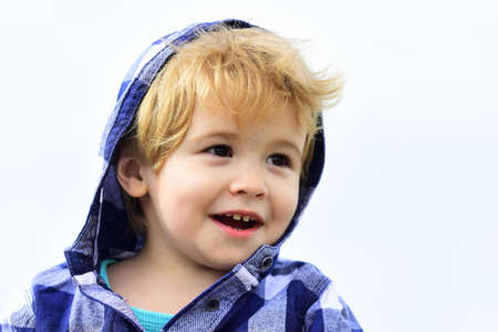 Kid on an autumn holiday. Close up child face.