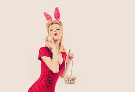 Pin up Easter. Lovely woman in rabbit costume. Happy woman preparing for Easter. Pinup woman in...