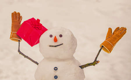 Merry Christmas and happy new year greeting card. Festive Art Greeting Card. New Year banner. Snowmen - gift presents concept. Snowman gifting. Happy smiling snow man - sale discount concept.の写真素材