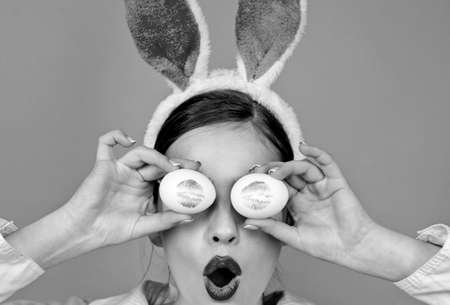 Happy easter. Young woman in rabbit bunny ears. Portrait of a happy woman in bunny ears. Egg hunt....