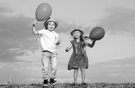 Kids having fun in autumn against blue sky. Child playing Happy childhood. Childhood on countryside....